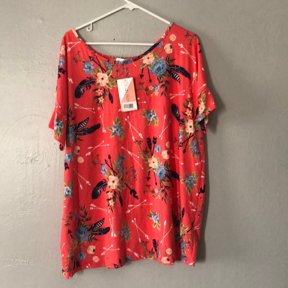 Flowy bright top can be worn with leggings or jean
